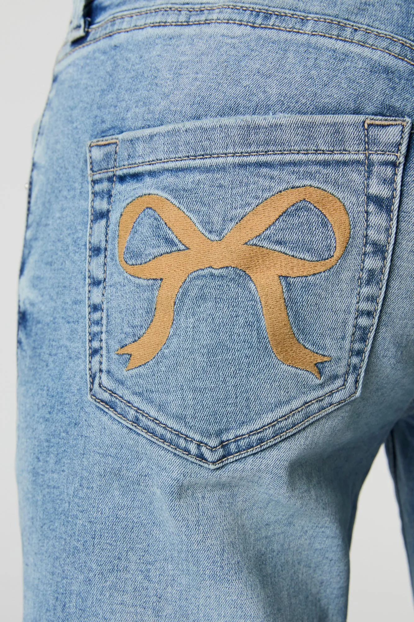 Bow Embroidered Low Rise Flare Jean sold by Urban Planet