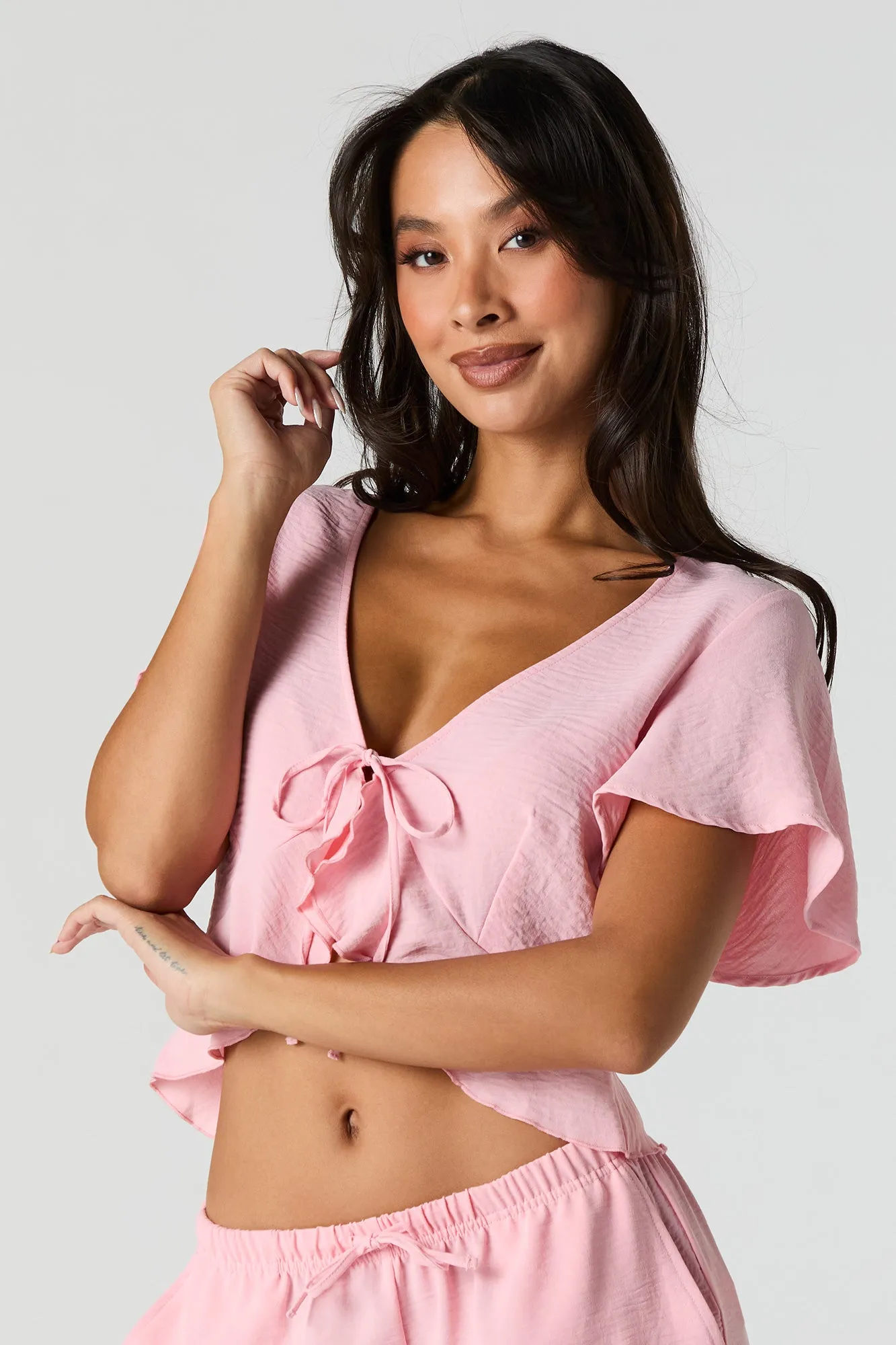 Flowy Tie Front Ruffle Crop Top sold by Urban Planet