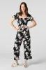 Printed Smocked Jumpsuit sold by Urban Planet