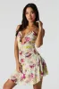 Minirobe asymétrique imprimée en filet avec découpes sold by Urban Planet