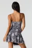 Minirobe asymétrique imprimée en filet avec découpes sold by Urban Planet