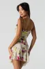 Minirobe asymétrique imprimée en filet avec découpes sold by Urban Planet