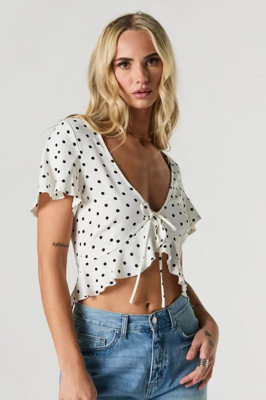 Polka Dot Flowy Flyaway Top sold by Urban Planet