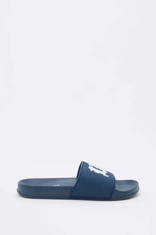 Mules avec motif LA embossé sold by Urban Planet