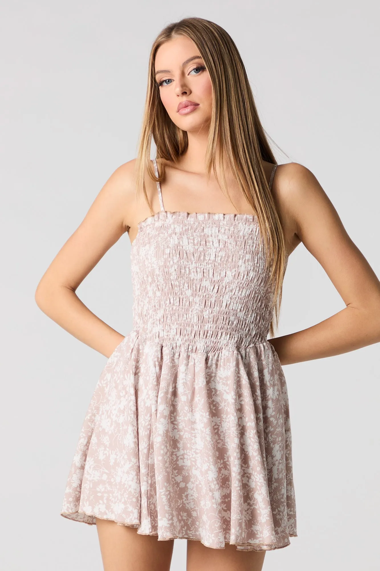 Smocked Dipped Waist Mini Romper sold by Urban Planet