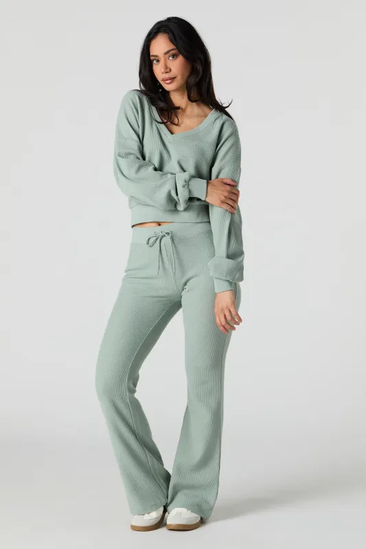 Pantalon en molleton en tricot gaufré à jambe évasée sold by Urban Planet