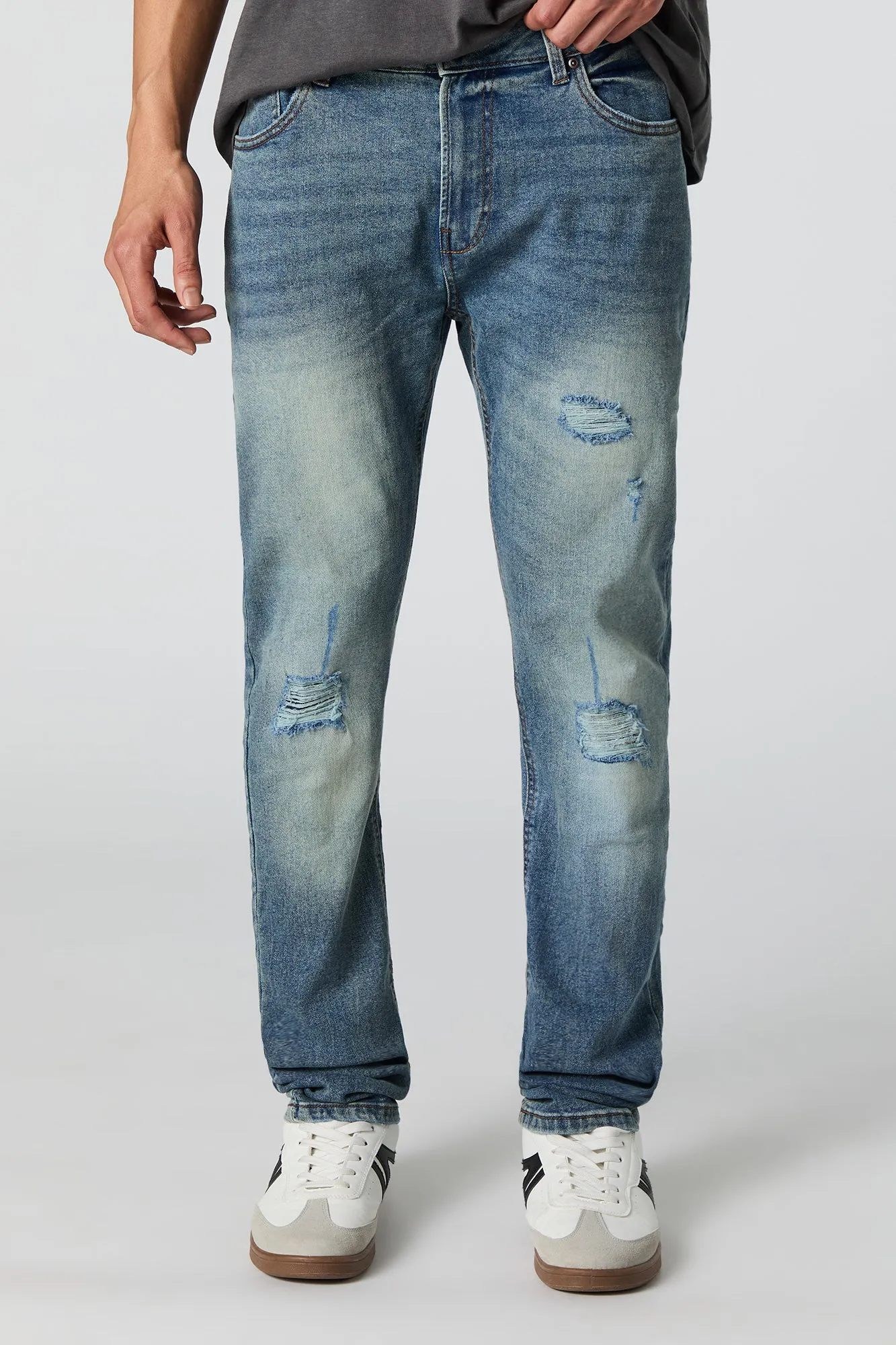 Jean mince extensible à effet d'usure lavé moyen sold by Urban Planet