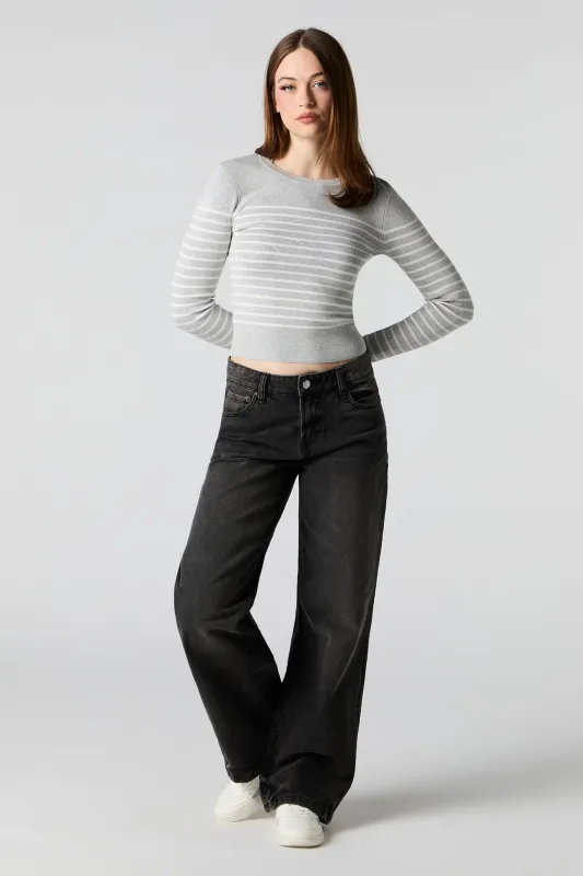 Jean à jambe large et taille basse délavé noir sold by Urban Planet