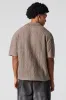 Polo texturé en tricot ouvert sold by Urban Planet