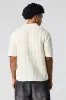 Polo texturé en tricot ouvert sold by Urban Planet