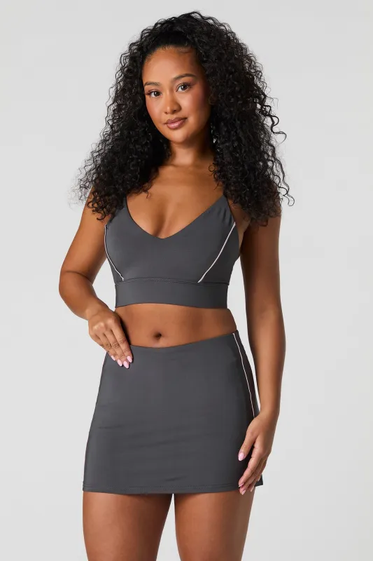 Active Piping Detail Mini Skort sold by Urban Planet