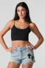 Short en denim d'aspect usé avec appliqué de croix sold by Urban Planet