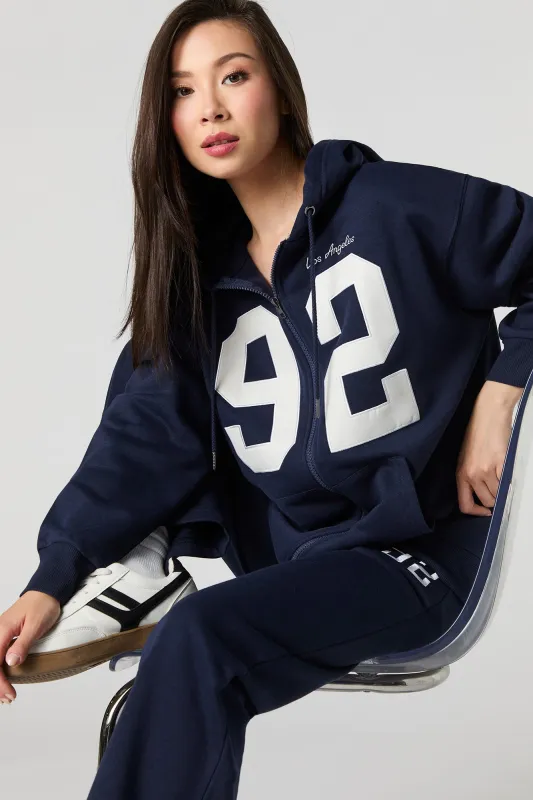 Destination Embroidered Zip-Up Fleece Hoodie sold by Urban Planet