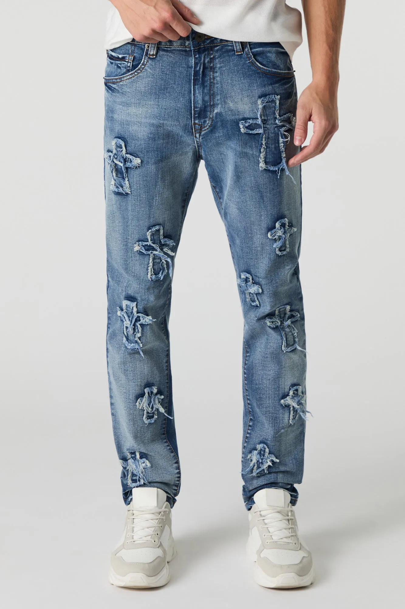 Distressed Cross Skinny Jean sold by Urban Planet