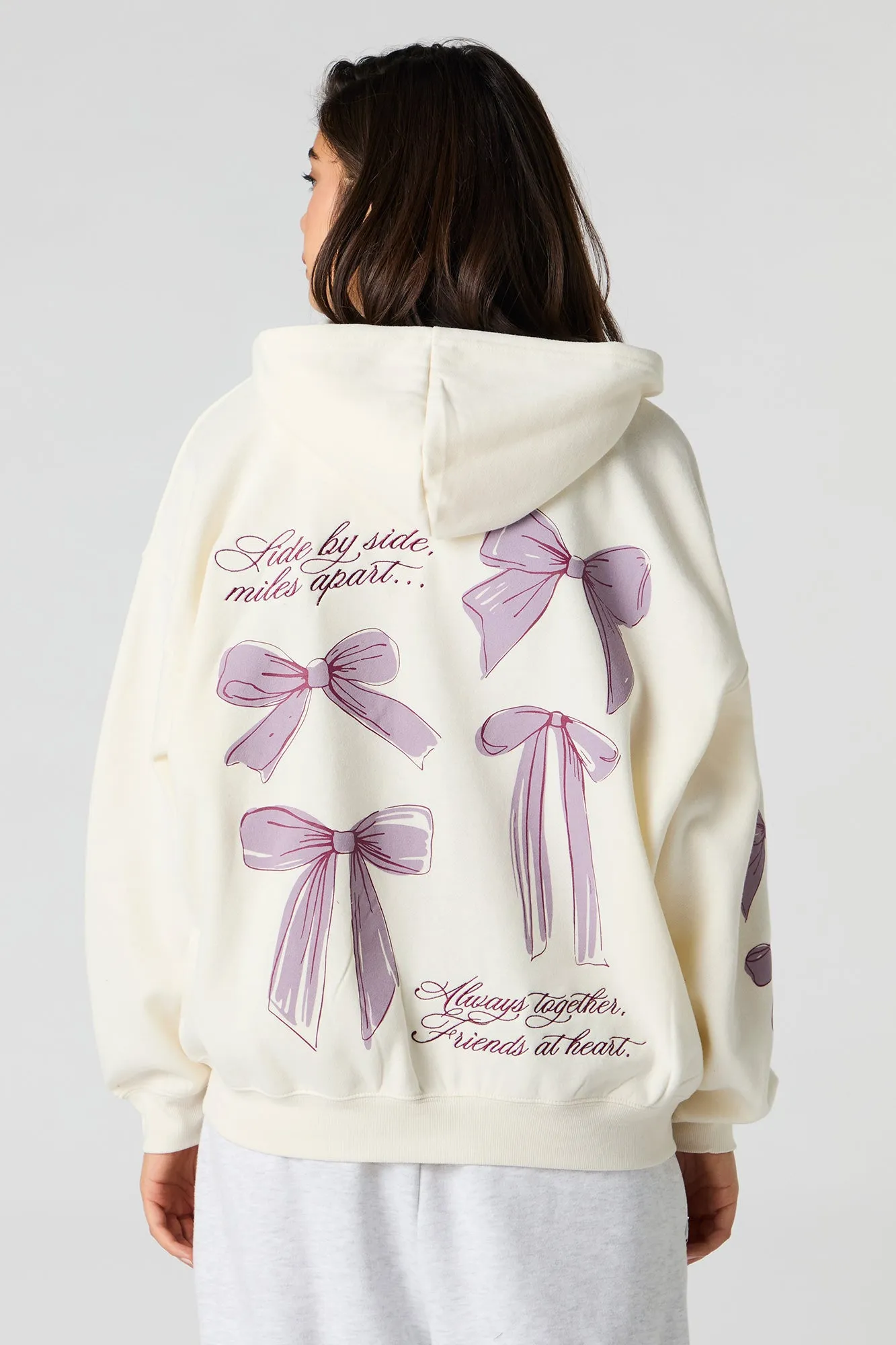 Oversized Bow Graphic Zip-Up Hoodie sold by Urban Planet