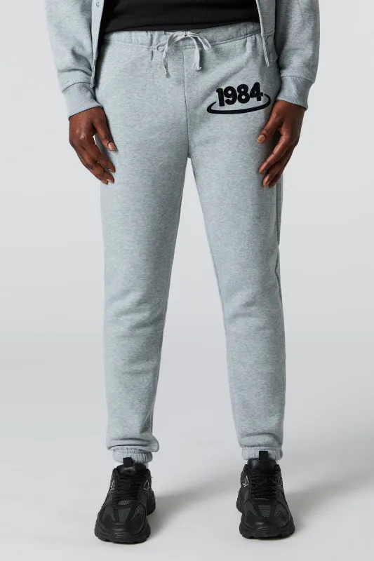 1984 Flock Print Fleece Jogger sold by Urban Planet