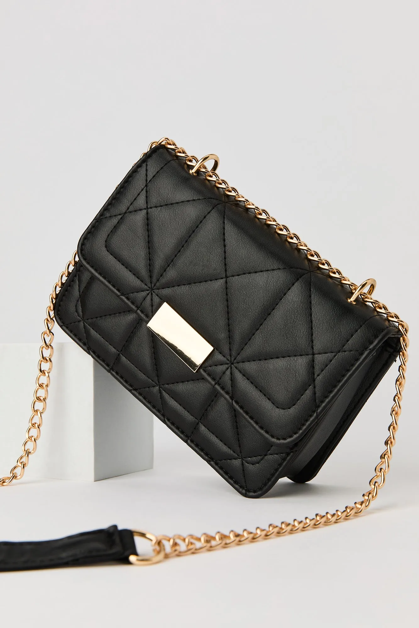 Faux Leather Quilted Crossbody Purse sold by Urban Planet