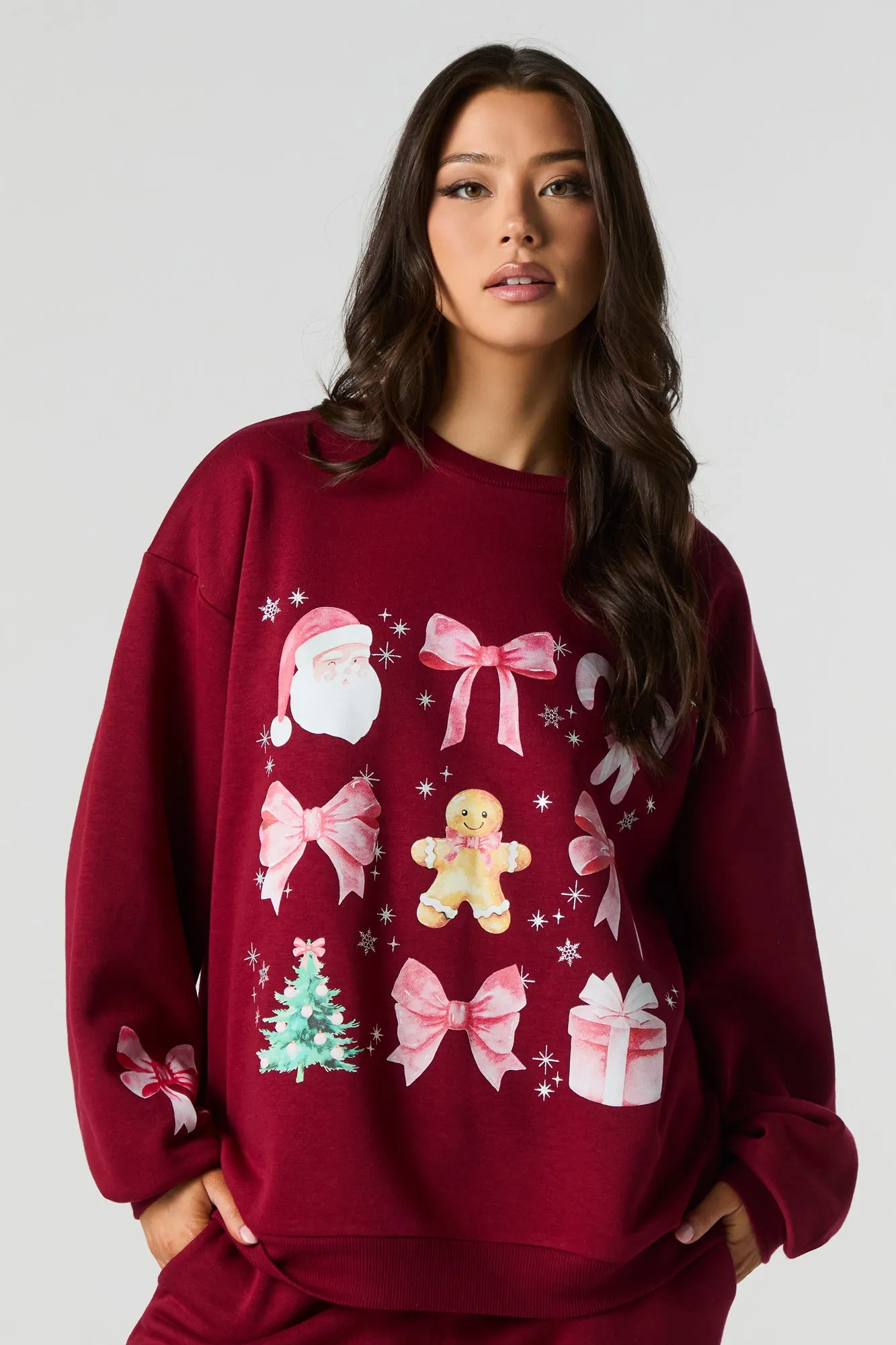 Christmas Bows & Santa Graphic Fleece Sweatshirt sold by Urban Planet