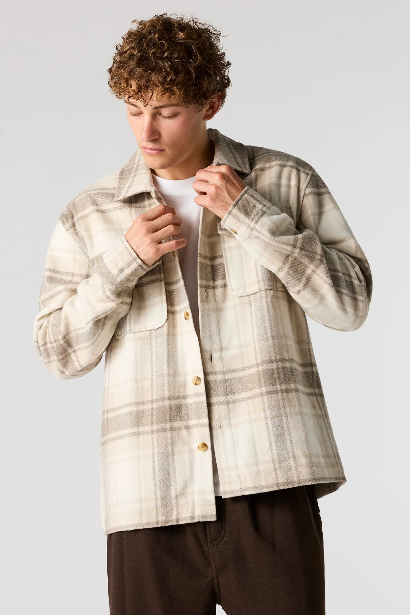 Plaid Shacket sold by Urban Planet