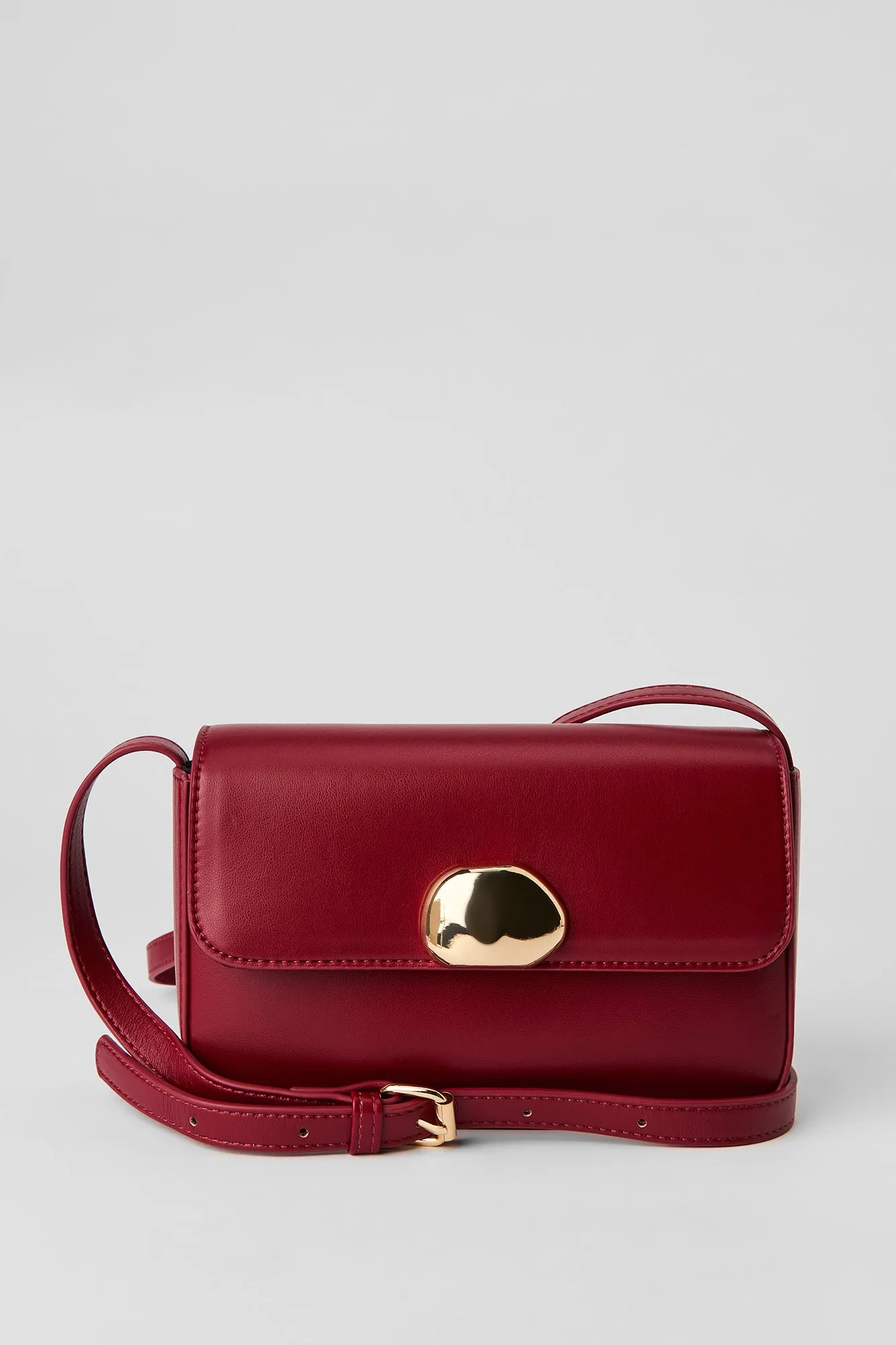 Faux Leather Metal Buckle Crossbody Purse sold by Urban Planet