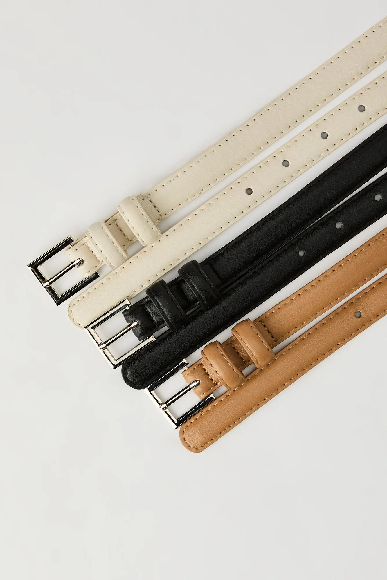Thin Faux Leather Belt (3 Pack) sold by Urban Planet