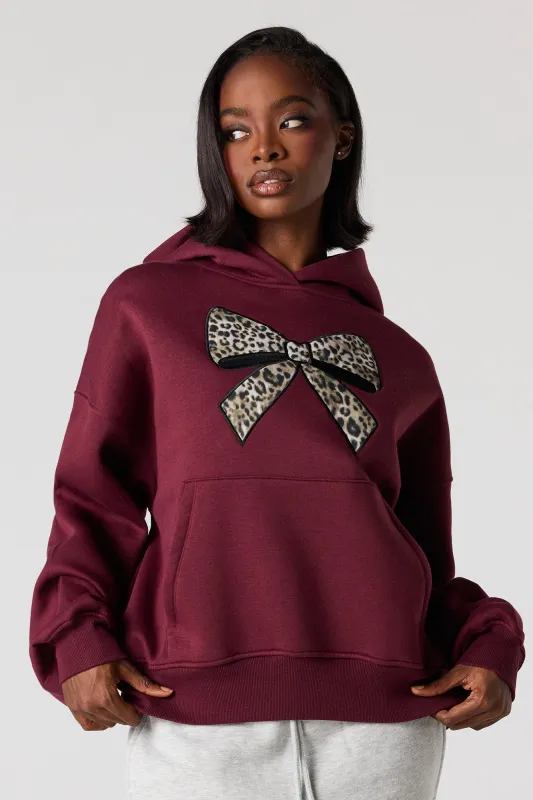 Cheetah Bow Twill Embroidered Boxy Fleece Hoodie sold by Urban Planet