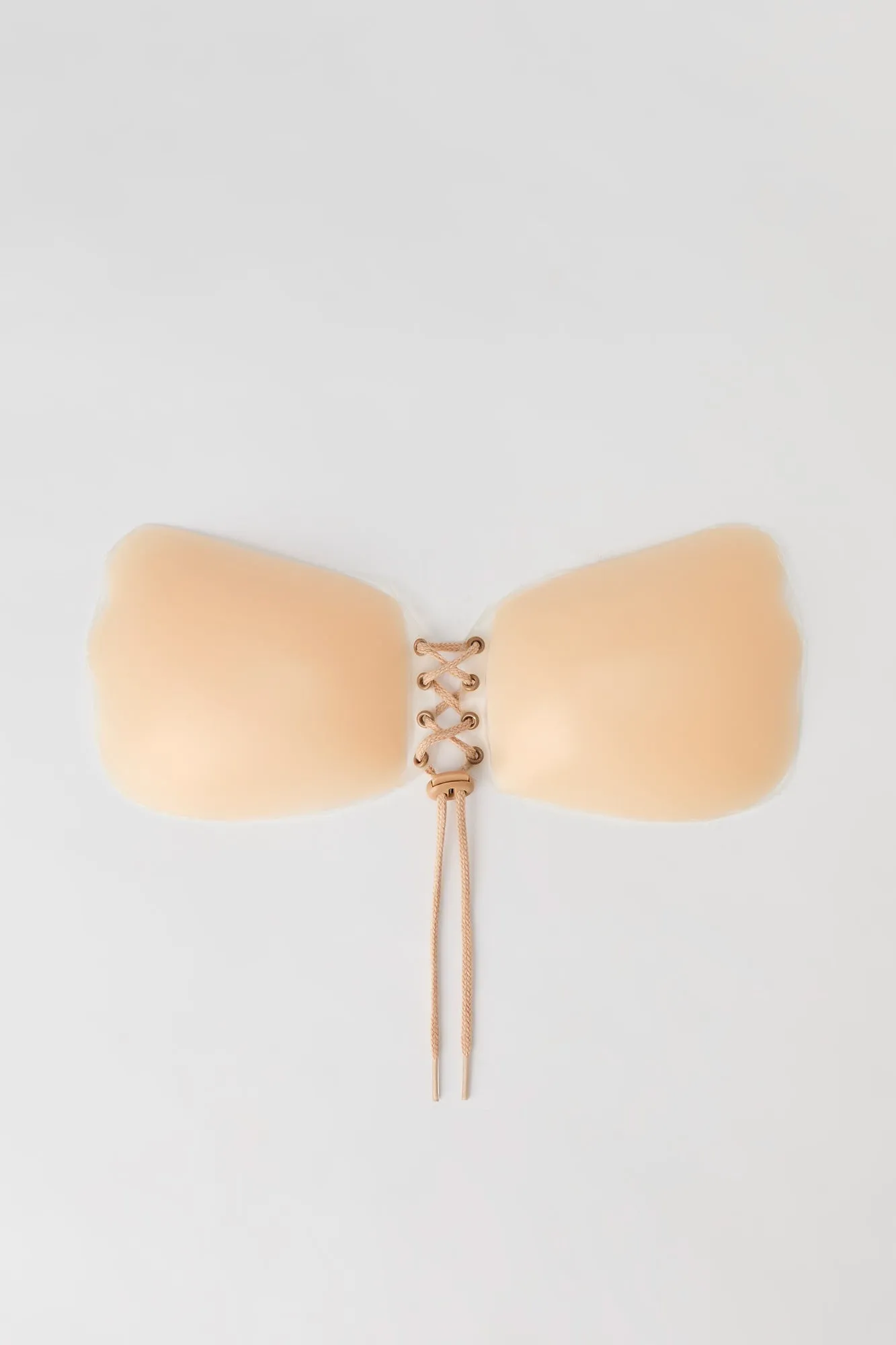 Lace-Up Adhesive Bra sold by Urban Planet