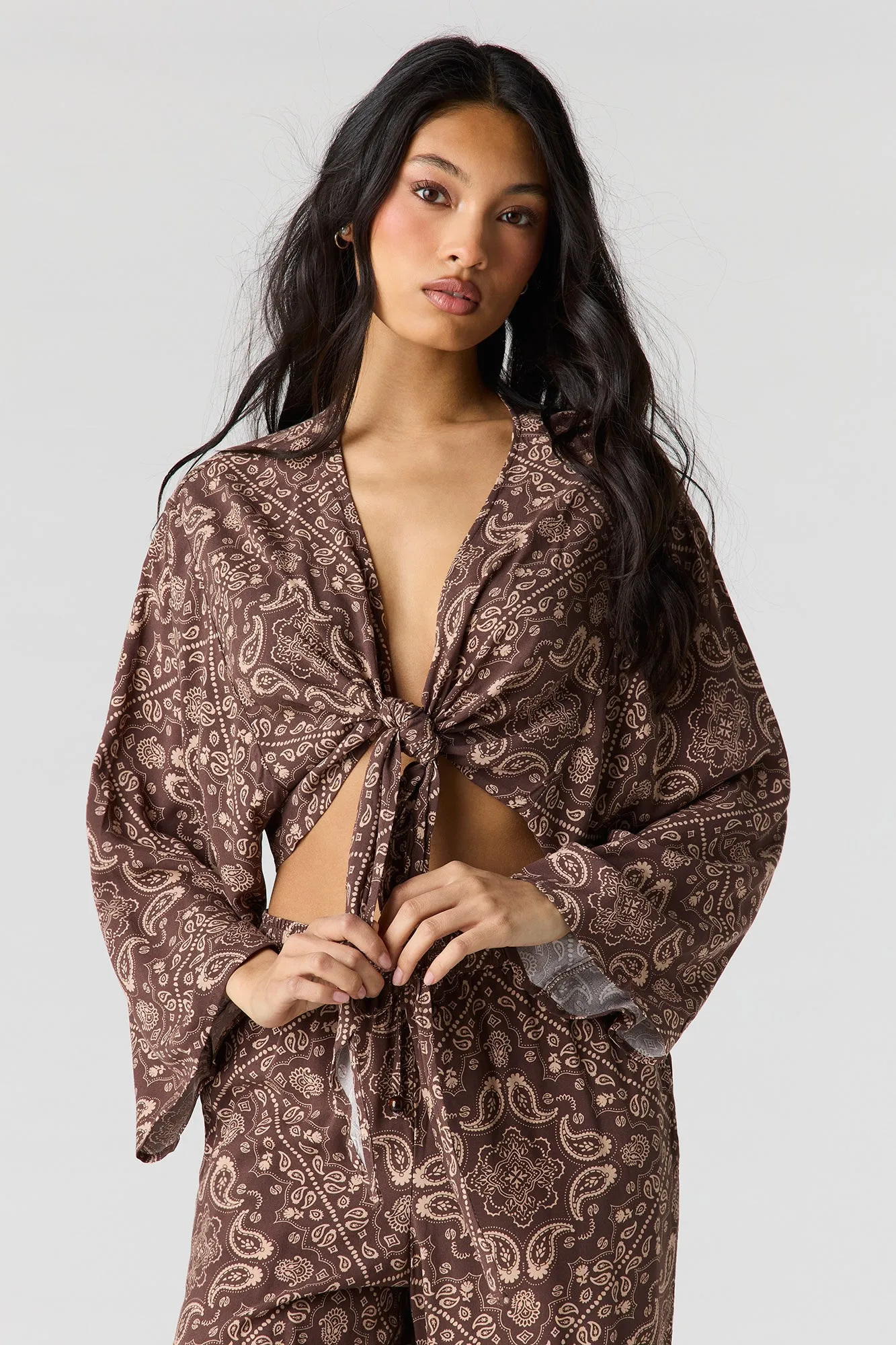 Flowy Tie Front Shrug sold by Urban Planet