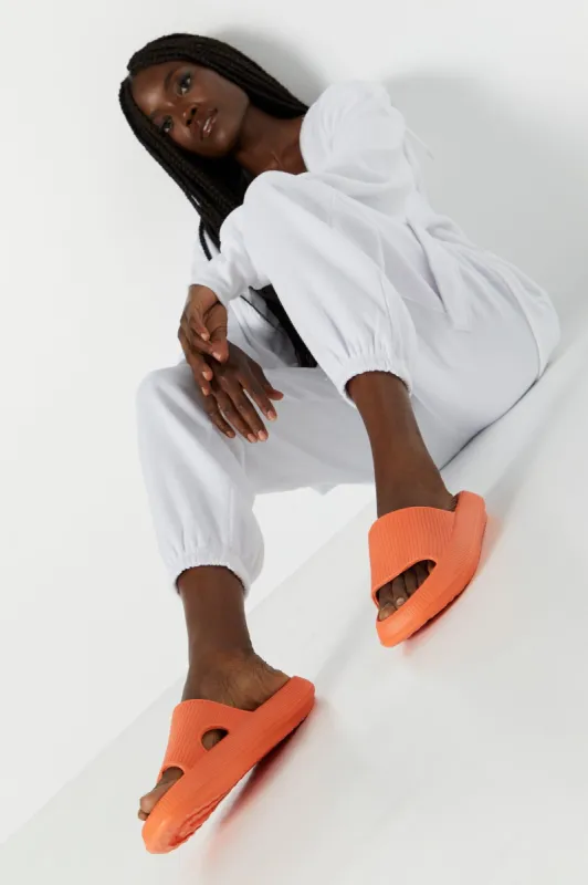 Mules éponge orange sold by Urban Planet