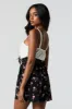 Combi-short boutonné fleuri noir à taille cintrée sold by Urban Planet