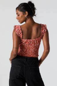 Haut de style laitière fleuri orange avec attache sold by Urban Planet