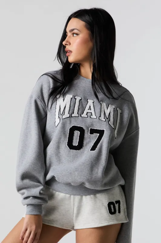 Miami Chenille Embroidered Fleece Sweatshirt sold by Urban Planet