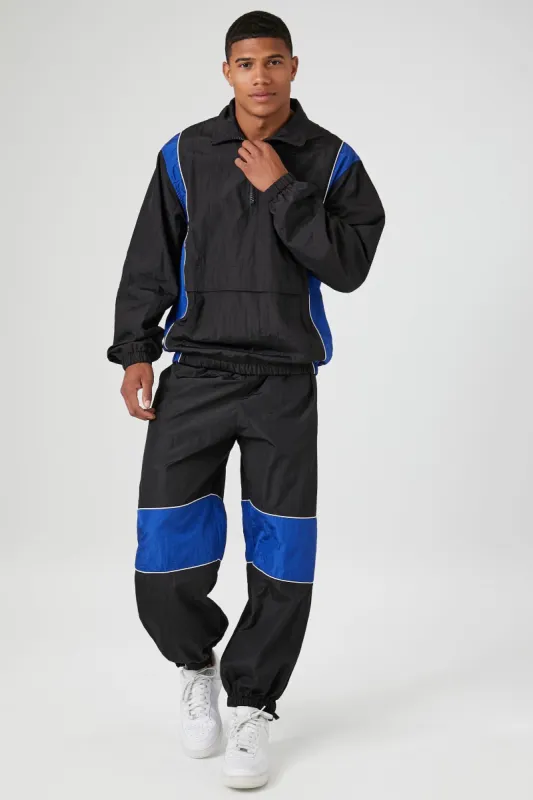Pantalon parachute rayé sold by Urban Planet