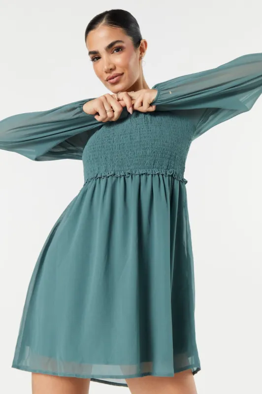 Smocked Long Sleeve Mini Dress sold by Urban Planet