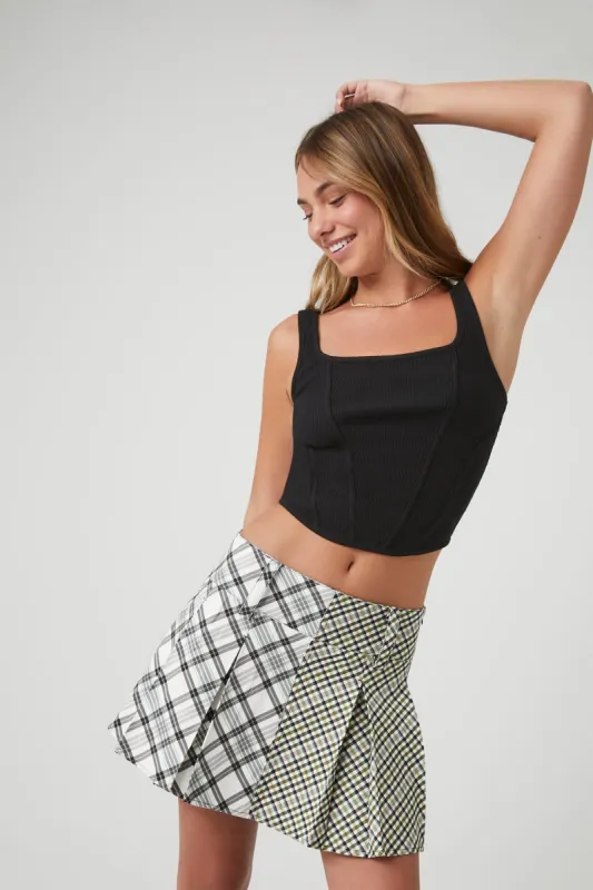 Pleated Reworked Plaid Mini Skirt sold by Urban Planet