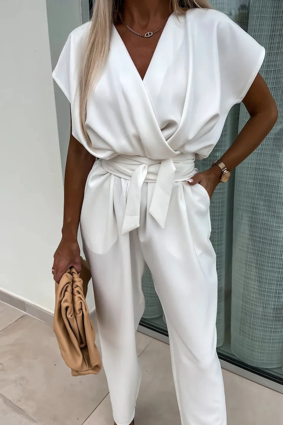 Brody White Sleeveless Belted Jumpsuit sold by Va Va Voom