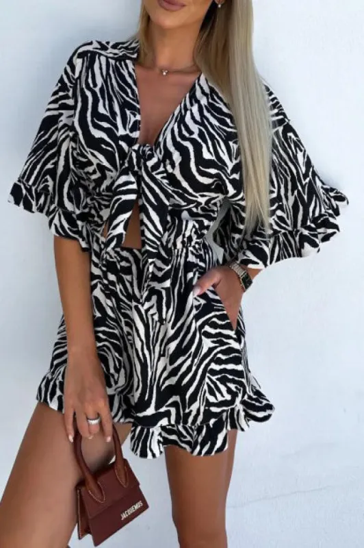 Heidi Black Zebra Print Knot Front Playsuit sold by Va Va Voom