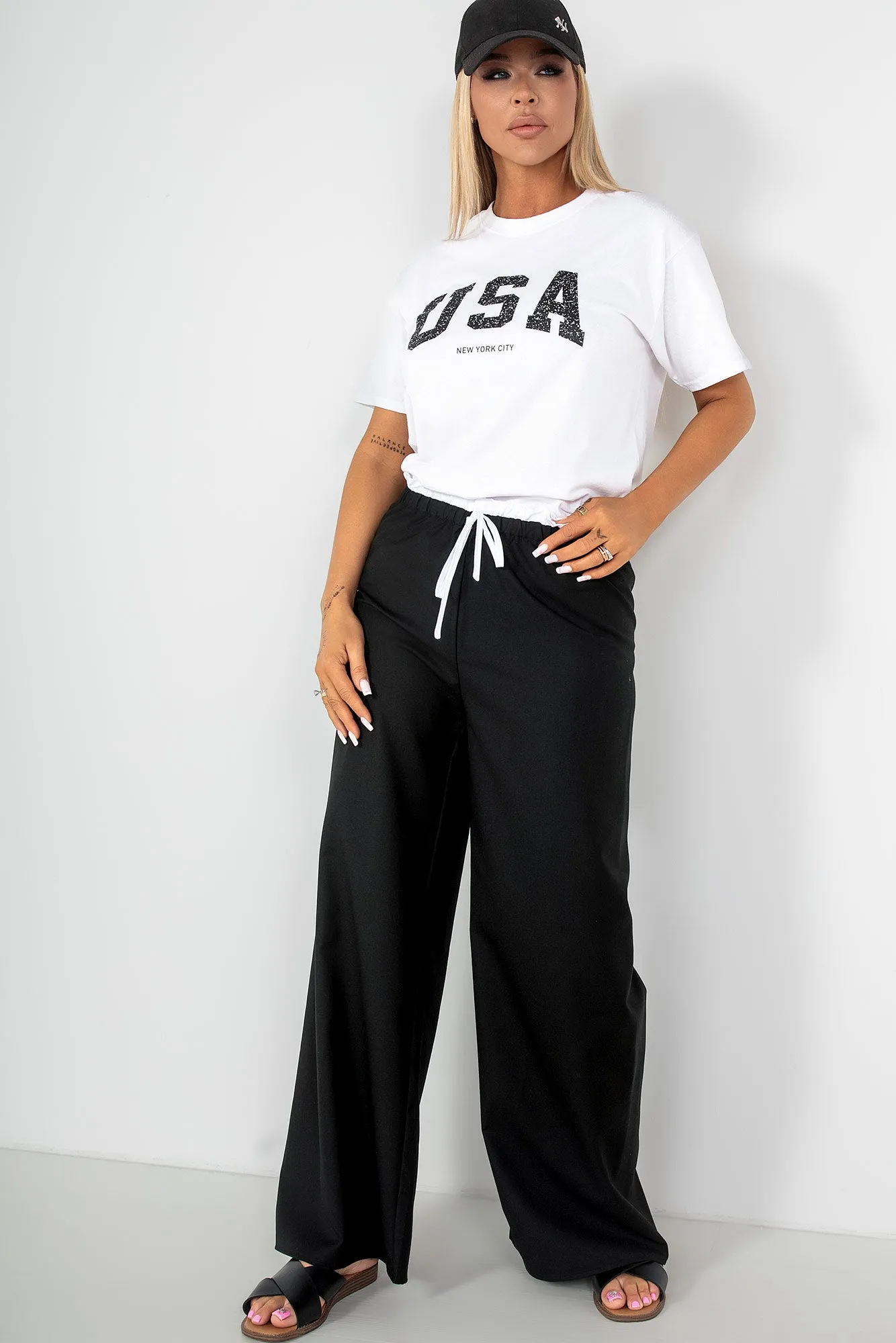 Palmira Black Wide Leg Trousers sold by Va Va Voom