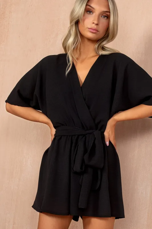 Anya Black Belted Wrap Playsuit sold by Va Va Voom