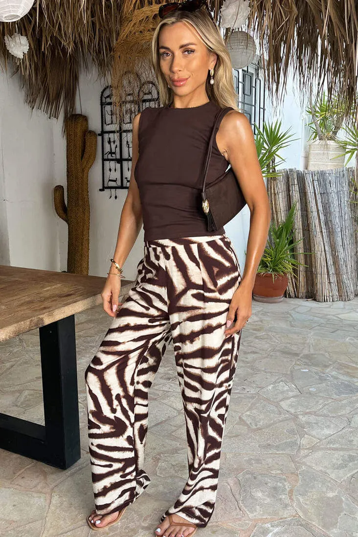 Della Brown Animal Print Wide Leg Trousers sold by Vavavoom