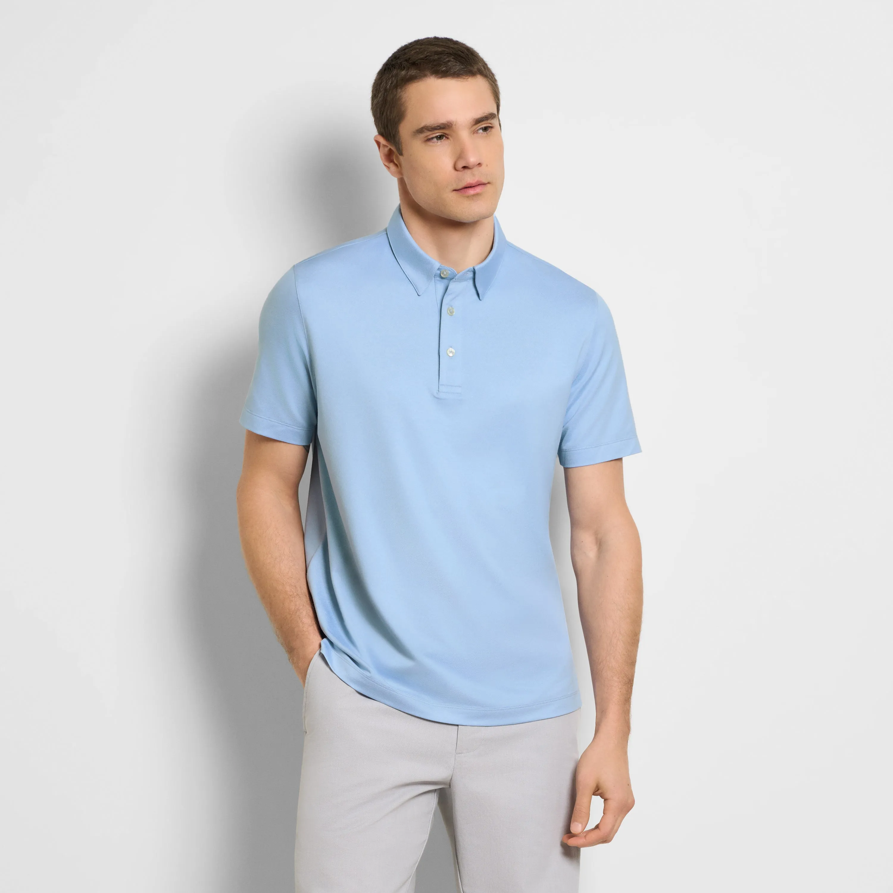 Performance Solid Twill Polo sold by Van Heusen