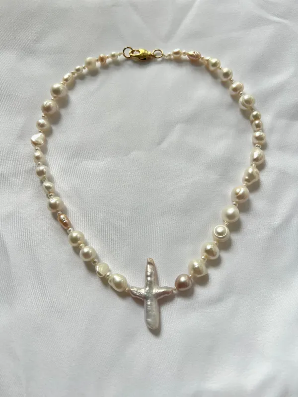 The Full Pearl Cross Necklace sold by Vanessa Mooney