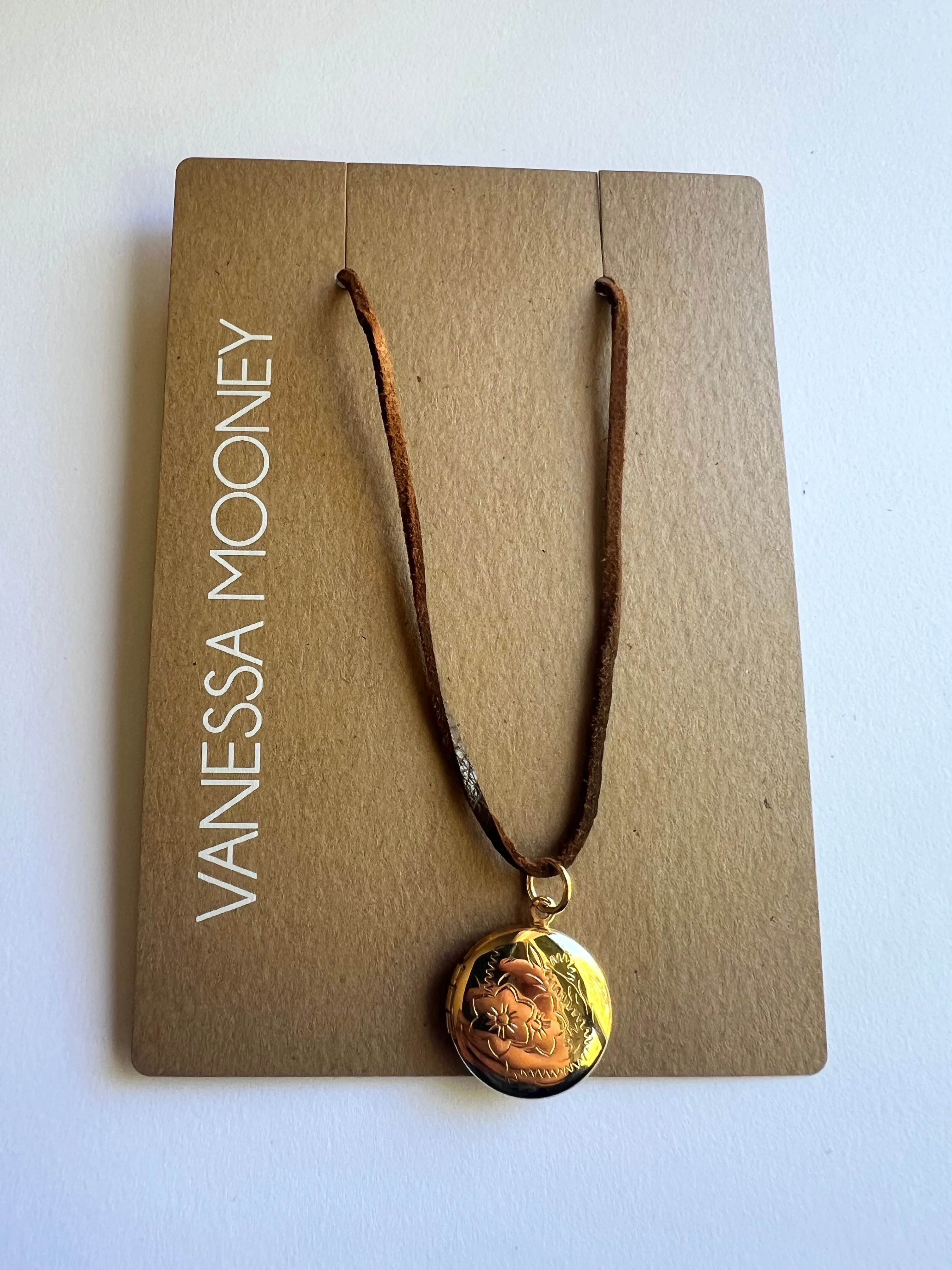 The Locket Charm Choker sold by Vanessa Mooney