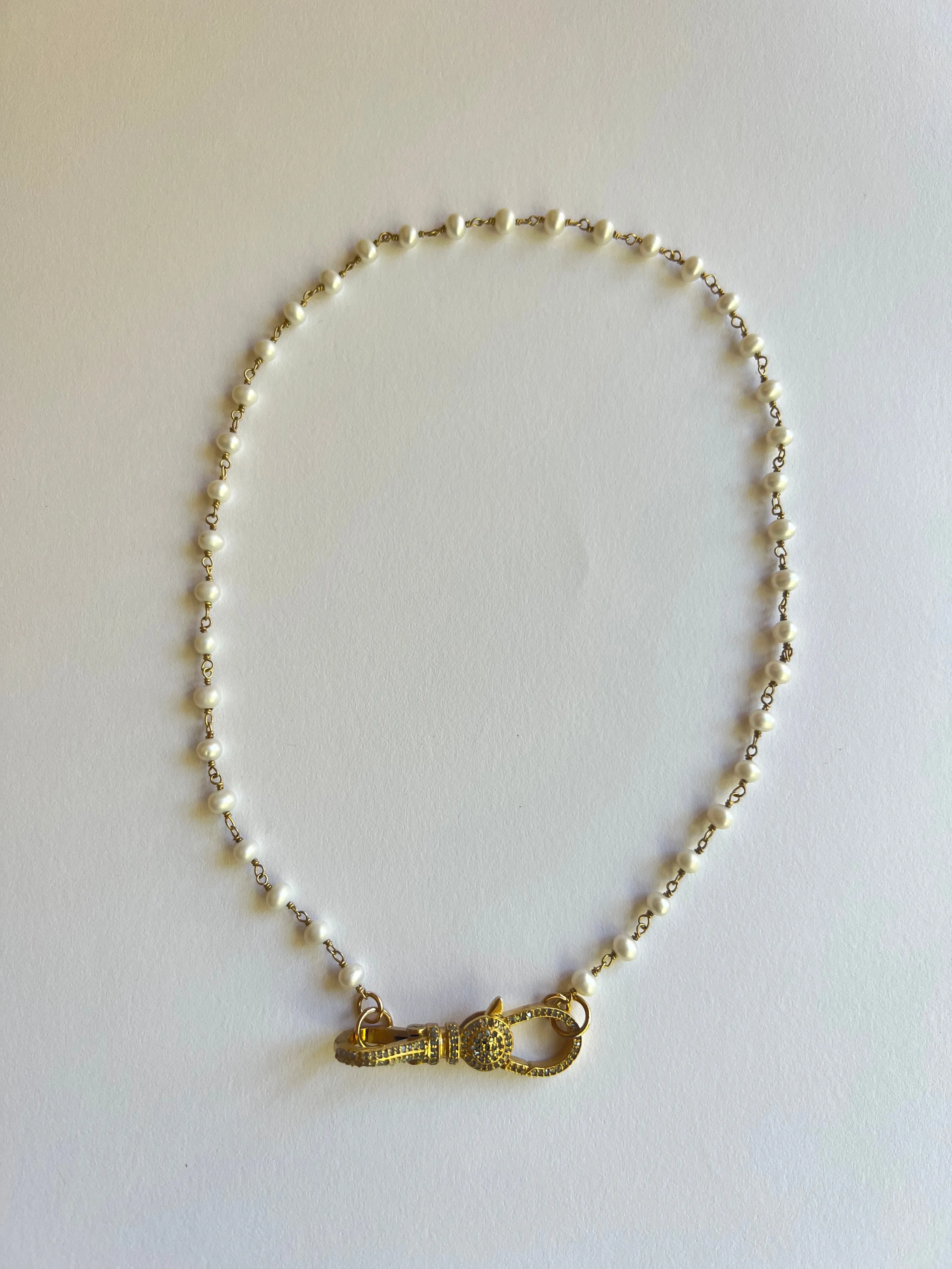 The Pearl & Diamond Clasp Necklace sold by Vanessa Mooney