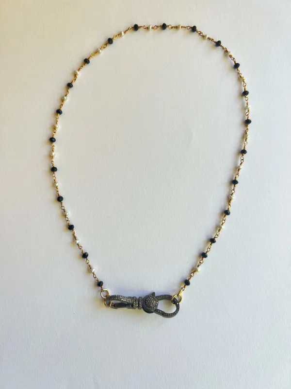 The Pearl & Oynx Diamond Clasp Necklace sold by Vanessa Mooney