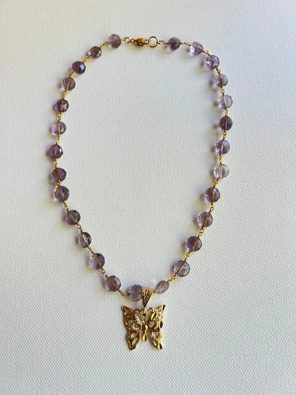 The Amethyst & Butterfly Necklace sold by Vanessa Mooney