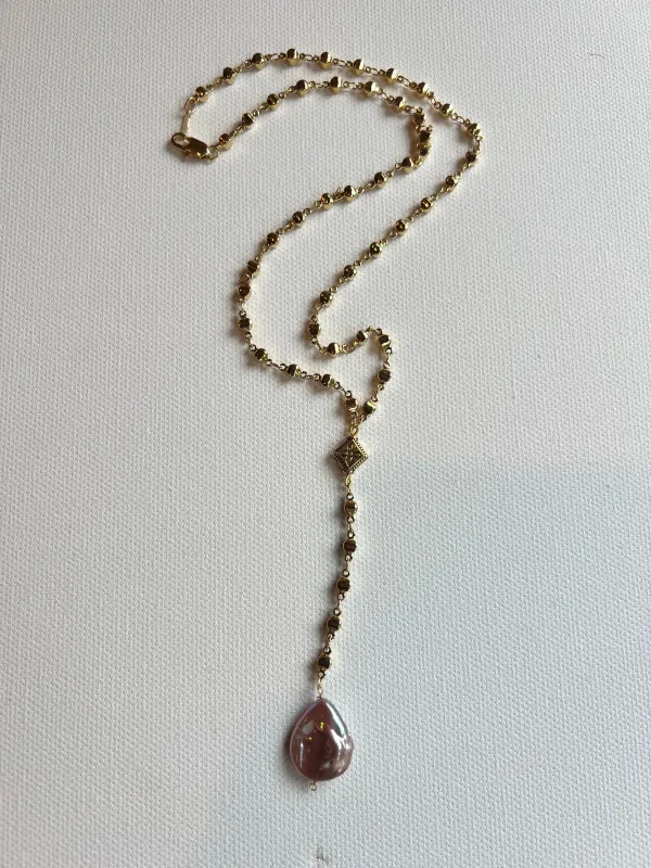 The Gold & Pearl Rosary Necklace sold by Vanessa Mooney