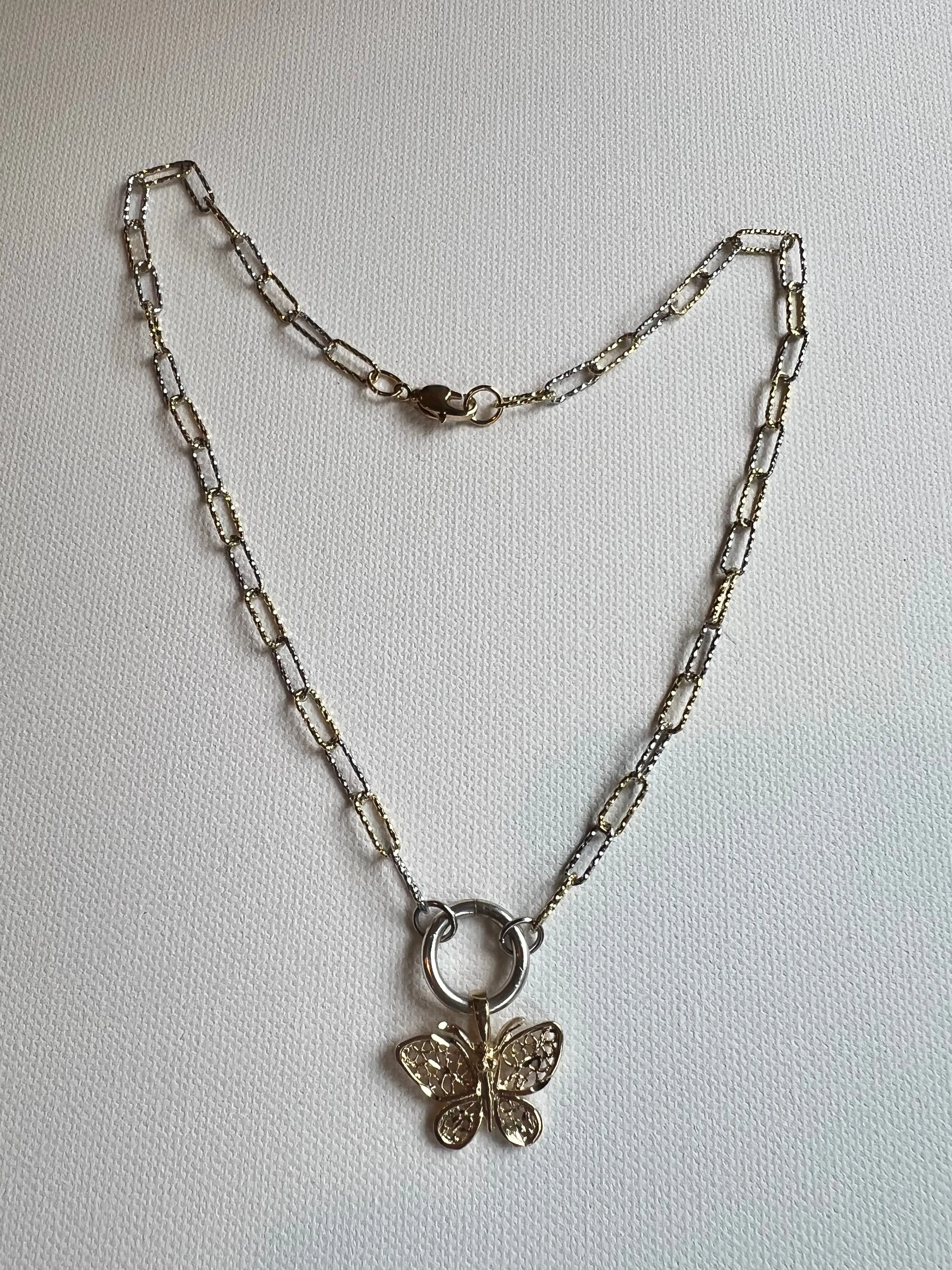 The Gold & Silver Butterfly Necklace sold by Vanessa Mooney