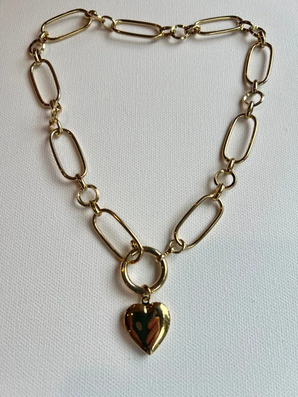 The Chain & Heart Locket Necklace sold by Vanessa Mooney