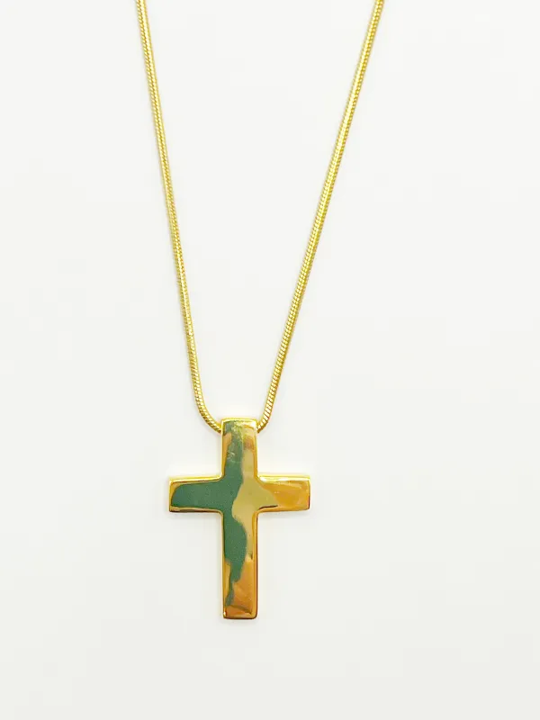The Classic Gold Cross Necklace sold by Vanessa Mooney
